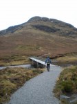 Peter approaching the bridge across the outflow of Loch a' Bhroin